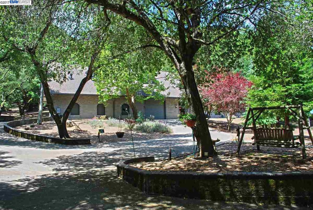 Building with trees and bench